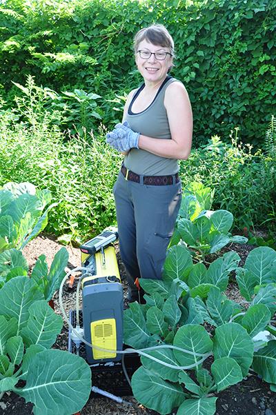 Grad student Jennifer Nicklay taking measurements at an urban farm in Minneapolis